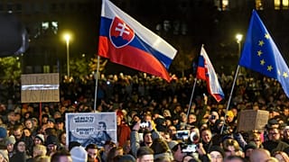 People take part in a protest against scrapping the Special Prosecutor's Office organised by the Slovakian opposition parties in front of the Government Office in Bratislava