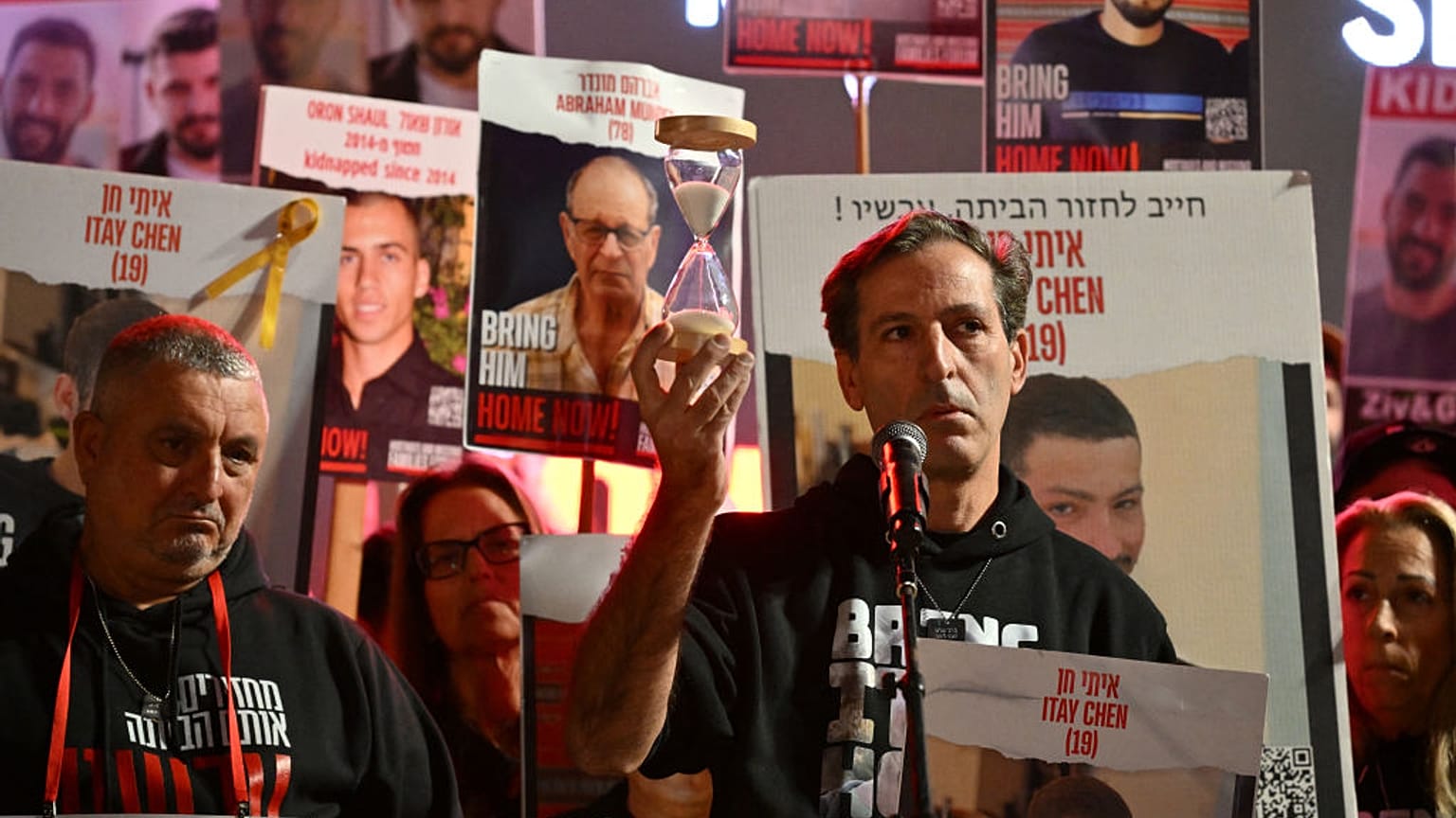 Bring them home: Ruby Chen, father of Israeli hostage Itay, held in Gaza since the 7 October attack, lifts an hourglass while delivering statement to media in Tel Aviv