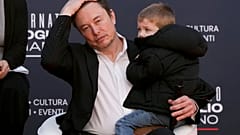Tesla's CEO Elon Musk, holding his son, attends the annual political festival Atreju, organised by the Brothers of Italy political party, in Rome, December 16th 2023