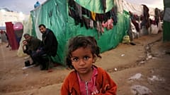 Palestinians struggle with cold weather as they stay in the makeshift tents they set up near Al Aqsa Martyrs Hospital in Deir al Balah, Gaza 