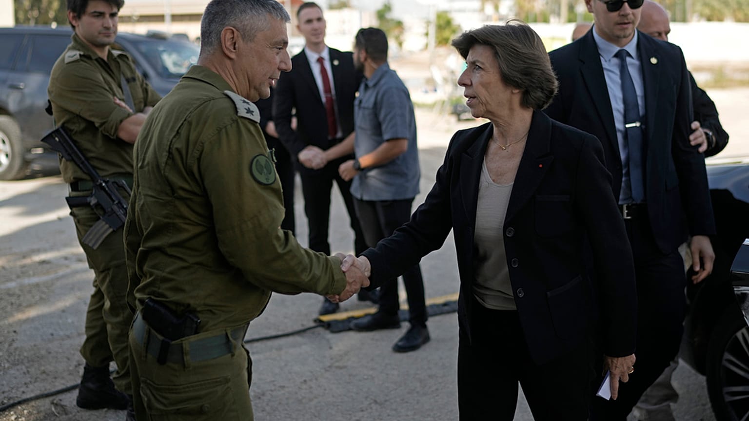 French Foreign Minister Catherine Colonna, right, is greeted by Israeli Col. Olivier Rafowicz as she arrives at the Shura military base, central Israel Sunday Dec. 17, 2023