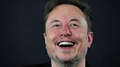 X (formerly Twitter) CEO Elon Musk laughs during an in-conversation event with Britain's Prime Minister Rishi Sunak in London on November 2, 2023, following the UK Artificial 