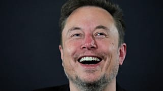 X (formerly Twitter) CEO Elon Musk laughs during an in-conversation event with Britain's Prime Minister Rishi Sunak in London on November 2, 2023, following the UK Artificial
