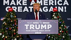 Former President Donald Trump speaks during a commit to caucus rally in Waterloo, Iowa on Tuesday