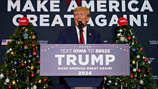 Former President Donald Trump speaks during a commit to caucus rally in Waterloo, Iowa on Tuesday