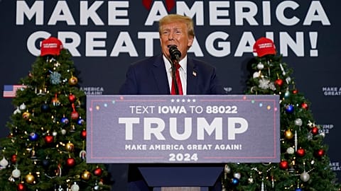 Former President Donald Trump speaks during a commit to caucus rally in Waterloo, Iowa on Tuesday