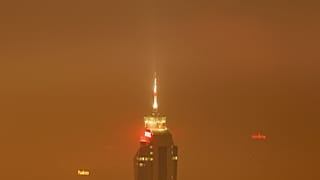 The Avaz Twist Tower building is seen through the haze as smog engulfs Sarajevo, Bosnia, Wednesday, Dec. 19, 2023