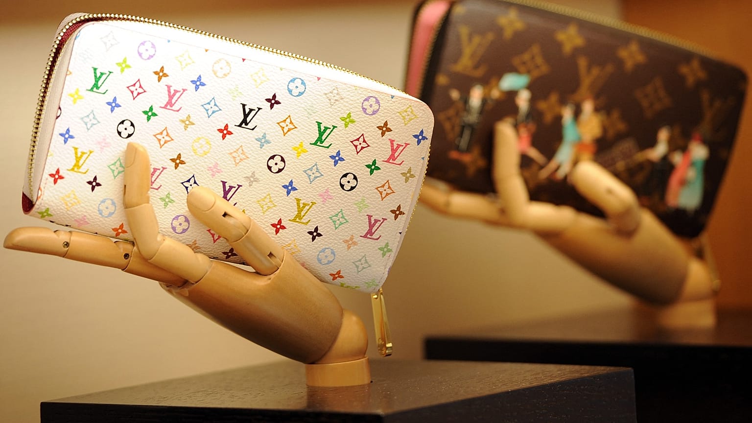Handbags are displayed in a Louis Vuitton shop on its opening day on January 27, 2012 in Rome. AFP PHOTO / GABRIEL BOUYS Gabriel BOUYS / AFP