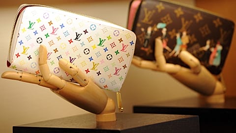 Handbags are displayed in a Louis Vuitton shop on its opening day on January 27, 2012 in Rome. AFP PHOTO / GABRIEL BOUYS Gabriel BOUYS / AFP