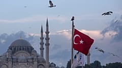 Seagulls fly over a Turkish flag in Istanbul Turkey - one of the cities where arrests were made