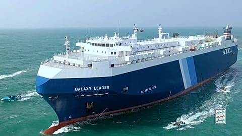 This photo released by the Houthi Media Center shows Houthi escort the cargo ship Galaxy Leader on Sunday, Nov. 19, 2023. 