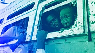 Refugees who fled the conflict in Ethiopia's Tigray region ride a bus in Hamdayet, eastern Sudan