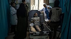 Palestinians who were arrested by the Israeli military in the north of the Gaza Strip and released through the Kerem Shalom crossing in the south wait for treatment in Rafah