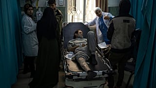Palestinians who were arrested by the Israeli military in the north of the Gaza Strip and released through the Kerem Shalom crossing in the south wait for treatment in Rafah