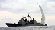 FILE: A Tomahawk Land Attack Missile (TLAM) launches from the guided missile cruiser USS Cape St. George (CG 71), 23 March 2003