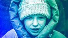 Anna, 10, cries next to the body of her brother Yurii, 27, during his funeral in Kalynivka, near Kyiv, February 2023