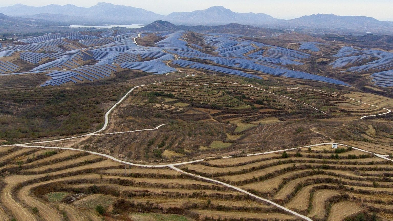 A solar farm operates next to Donggou village in the northern China's Hebei province, 10 November 2023.