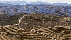 A solar farm operates next to Donggou village in the northern China's Hebei province, 10 November 2023.