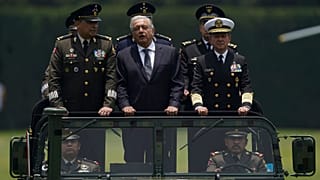 Mexico's President Andres Manuel Lopez Obrador, centre, Defense Secretary Luis Cresencio Sandoval, left, and Naval Commander Jose Rafael Ojeda in Mexico City, August 2021.