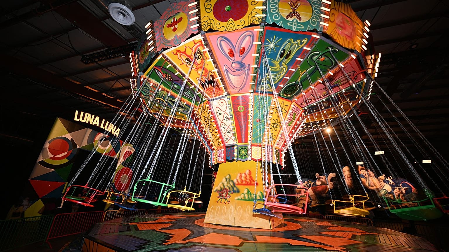 The Kenny Scharf painted chair swing ride in motion at "Luna Luna: Forgotten Fantasy", on December 22, 2023 in Los Angeles, California.