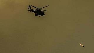 An Israeli Apache helicopter fires a missile in direction of the Gaza Strip, as seen from southern Israel, Friday, Dec. 29, 2023. 