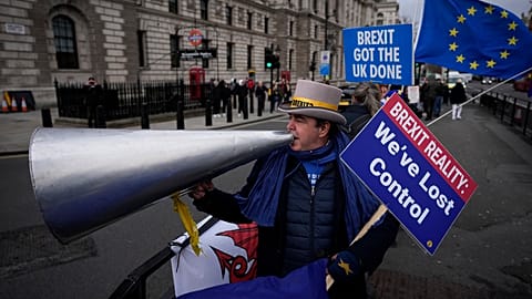 Long-term anti-Brexit protester Steve Bray demonstrates across the road from the Houses of Parliament 