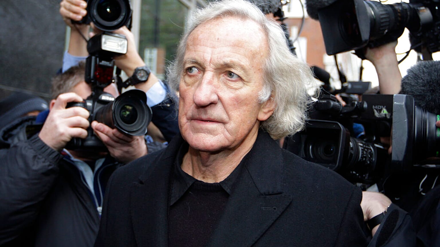 Journalist John Pilger, a supporter of Wikileaks founder Julian Assange arrives at the City of Westminster Magistrates Court in London in 2010