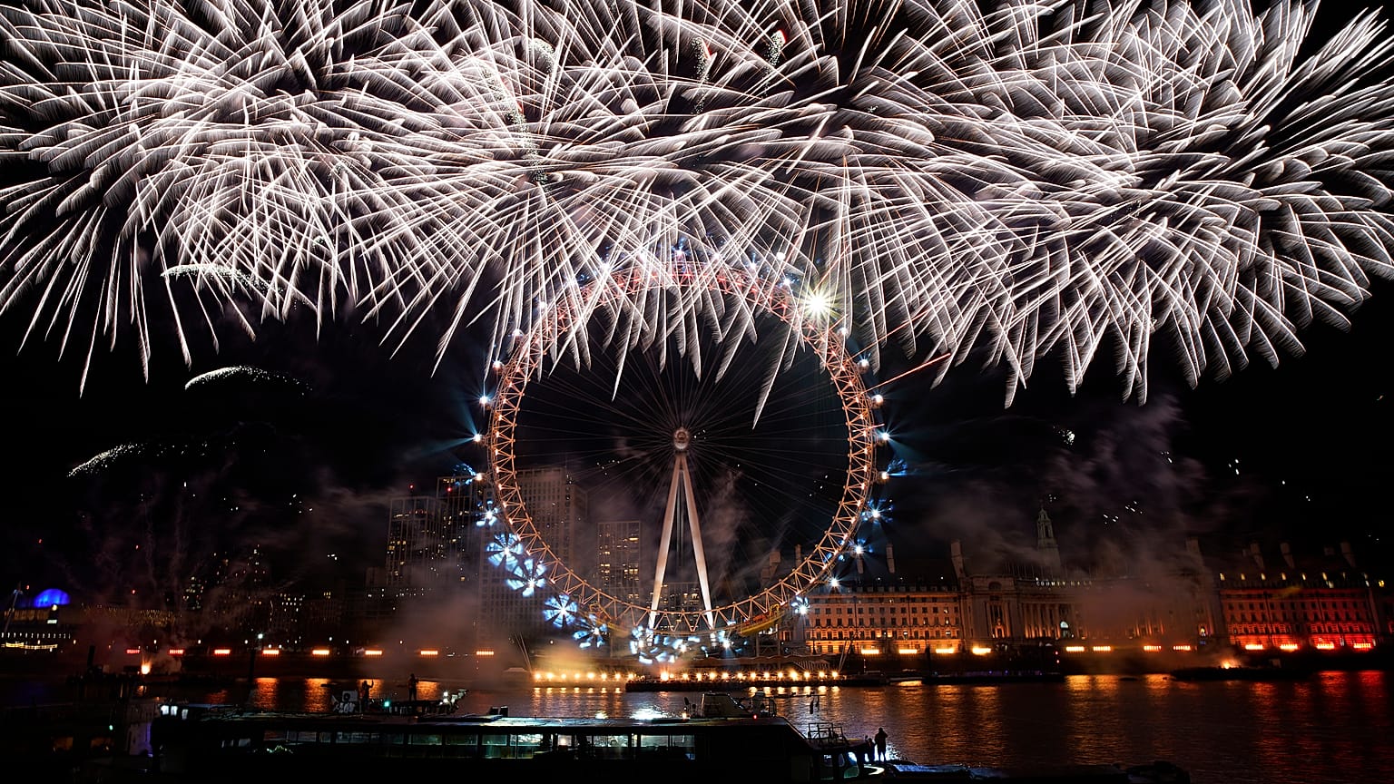 Fireworks light-up the sky over the London Eye in central London to celebrate the New Year on Monday, Jan. 1, 2024.