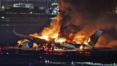 A Japan Airlines plane on fire at Haneda Airport.