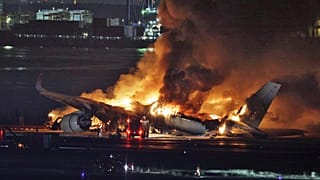 A Japan Airlines plane on fire at Haneda Airport.