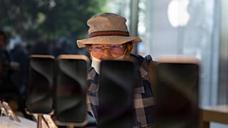 A man looks at the Apple's new iPhone 15 models on the first day of sales at an Apple Store at The Grove in Los Angeles.