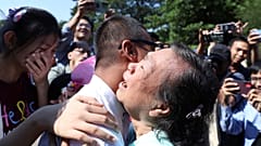 Kaung Sett Lin, center, photojournalist, is welcomed by family members and colleagues after he was released Insein Prison in Yangon, Myanmar, Thursday, Jan. 4, 2024.