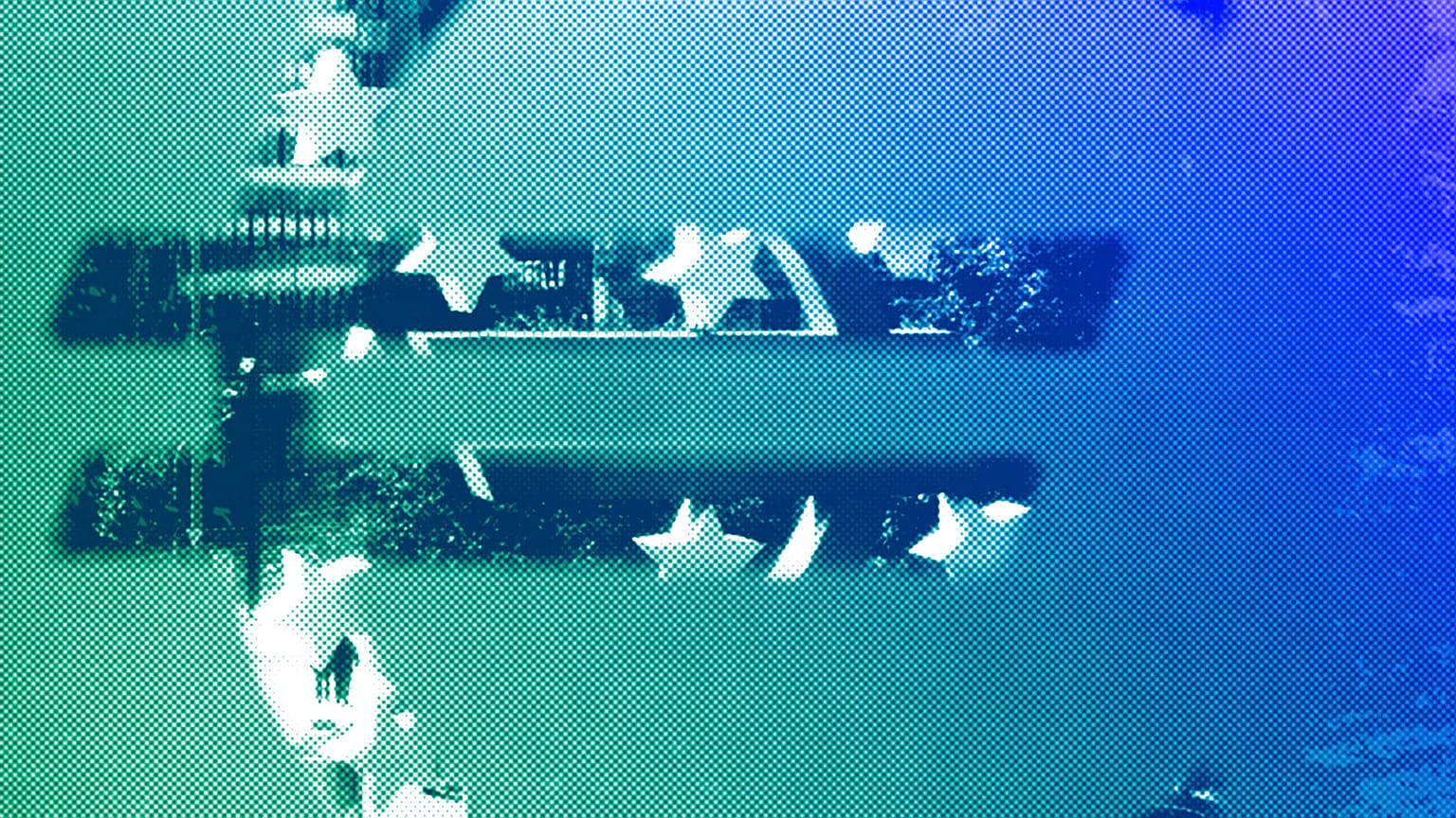 The Euro sculpture is photographed through the logo of the European Central Bank in Frankfurt, October 2008