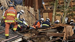 Rescuers conduct a search operation in Wajima, Ishikawa prefecture, Japan Friday, Jan. 5, 2024.