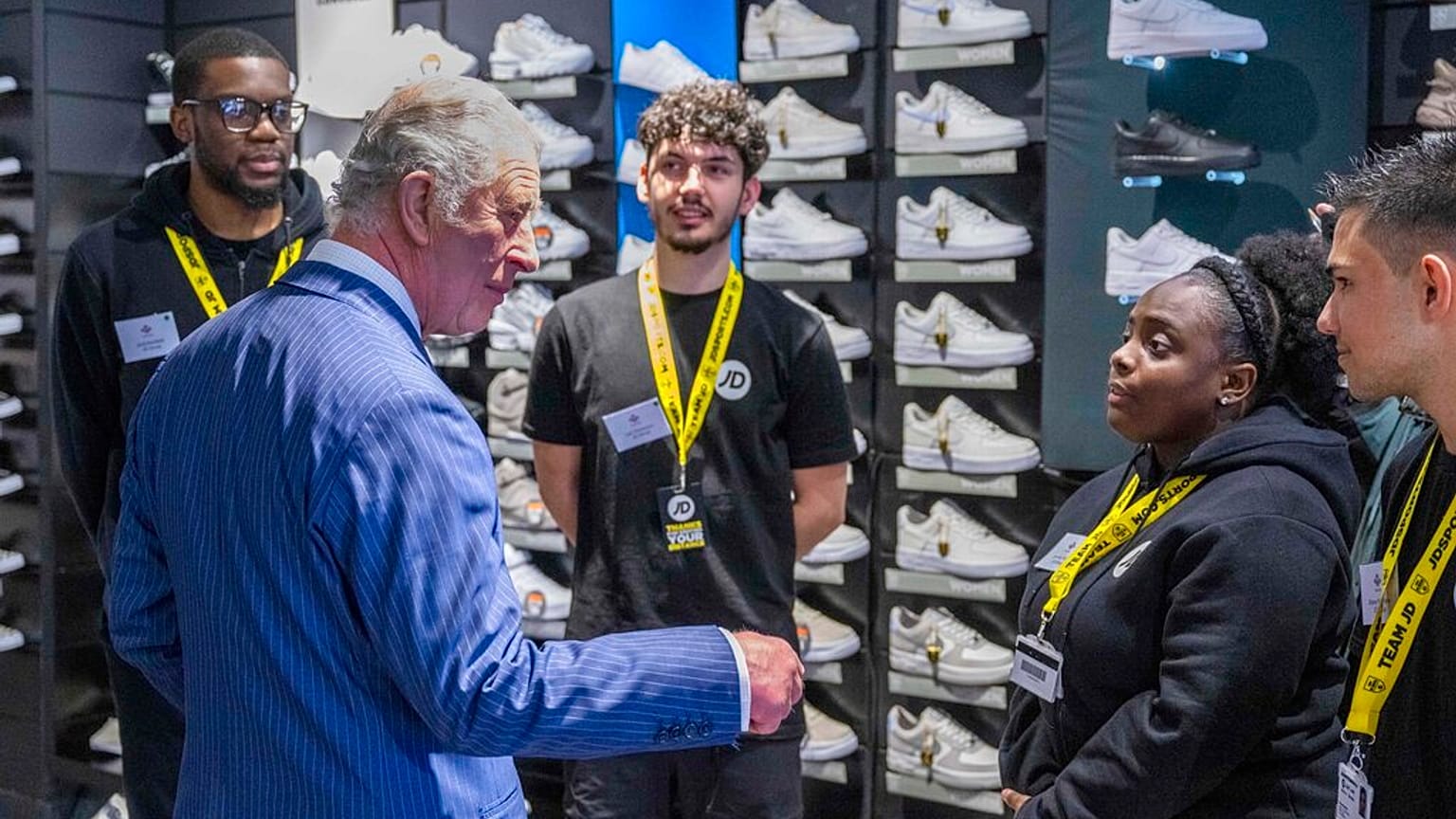 Britain's Prince Charles visits a JD Sports store in London, Wednesday May 11, 2022, to meet young people supported by The Prince's Trust through the UK Government's Kickstart