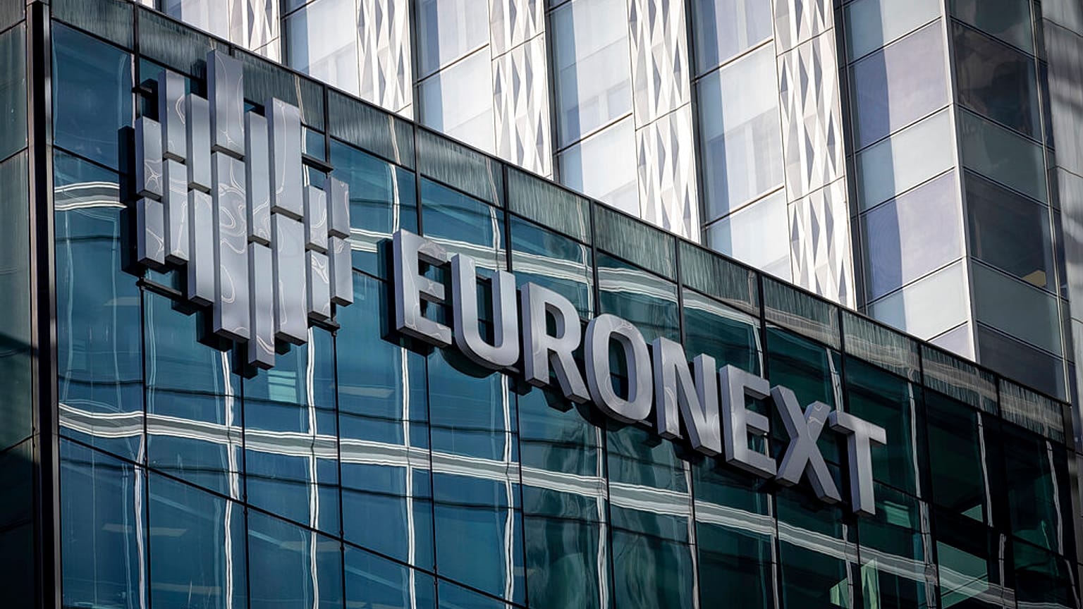 The logo of Euronext is pictured at its headquarters in the La Defense business district in Courbevoie near Paris, France, Wednesday, March 1, 2023. (AP Photo/Aurelien Morissa