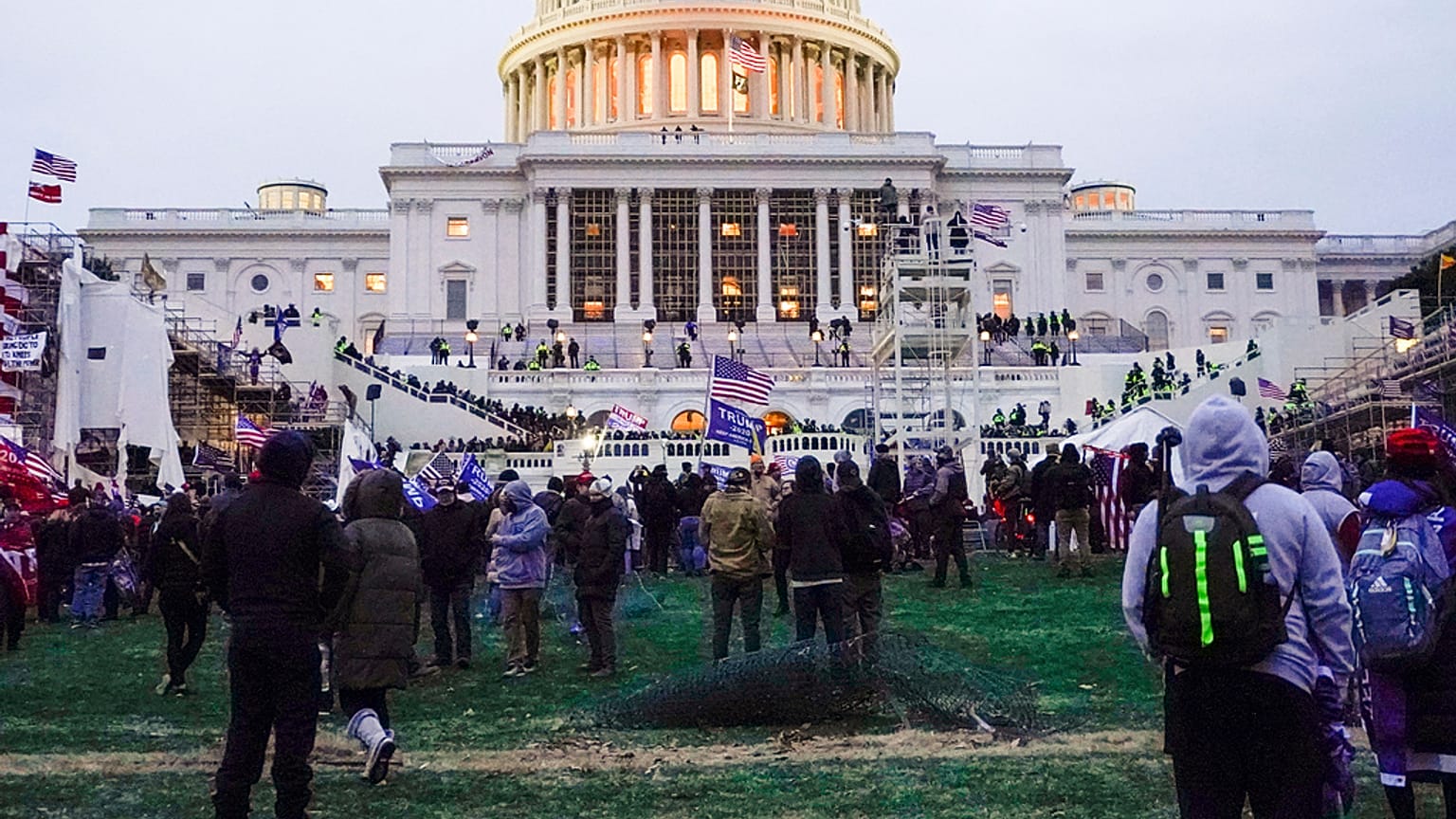 Rioters walk on the West Front at the U.S. Capitol on 6 January, 2021, in Washington DC