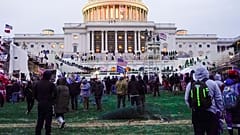 Rioters walk on the West Front at the U.S. Capitol on 6 January, 2021, in Washington DC