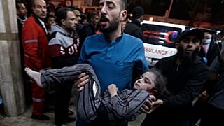 A Palestinian child wounded during the Israeli bombardment of the Gaza Strip is brought to the Nasser hospital in Khan Younis, Southern Gaza Strip