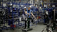 Brompton folding bicycles are assembled by hand at the Brompton factory in west London, Tuesday, Nov. 24, 2020. 