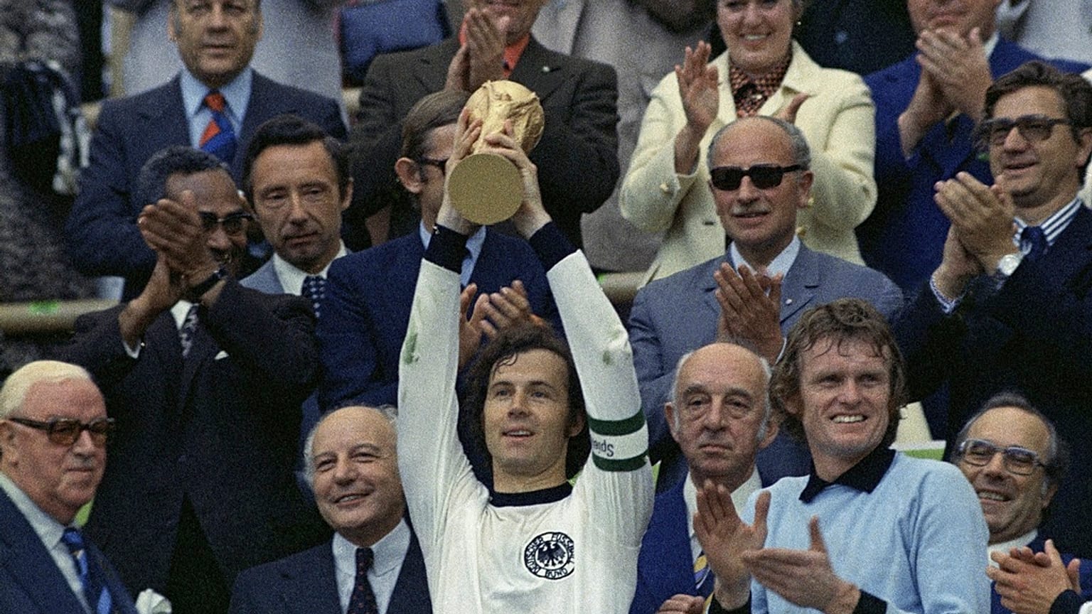 West Germany captain Franz Beckenbauer holds up the World Cup trophy after his team defeated the Netherlands by 2-1, in the World Cup soccer final at Munich's Olympic stadium.