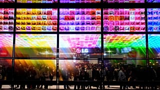 People look at an exhibit of LG Signature OLED T 4K transparent wireless TV's at the LG booth during the CES tech show Tuesday, January 9, 2024, in Las Vegas.