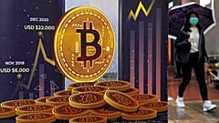 An advertisement for Bitcoin cryptocurrency is displayed on a street in Hong Kong.