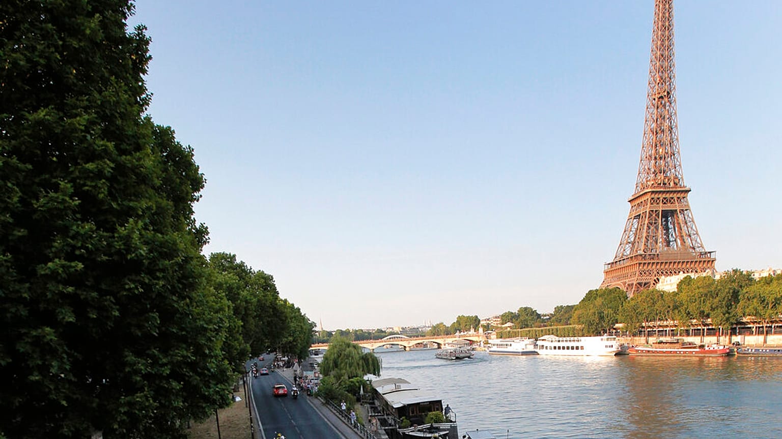 In this July 21, 2013 file photo shows the road along the Seine river, with the Eiffel Tower at right, in Paris. 