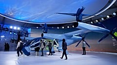 People look at the Supernal S-A2 passenger electric VOTL aircraft at the Supernal booth during the CES tech show Wednesday, January 10, 2024, in Las Vegas.