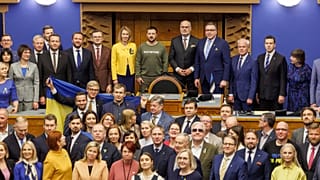 Volodymyr Zelenskyy Estonia's President Alar Karis and PM Kaja Kallas, pose with parliamentarians in Tallinn, 11 January 2024