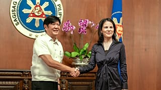 Philippine President Ferdinand Marcos Jr., left, greets German Foreign Minister Annalena Baerbock during her courtesy call at the Malacanang presidential palace in Manila