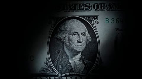 The likeness of George Washington is seen on a U.S. one dollar bill, March 13, 2023, in Marple Township, Pa. 