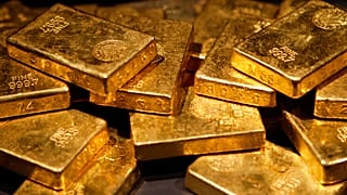 FILE - In this file photo taken Nov. 8, 2006, gold bars are on display at the "Gold" exhibit in the American Museum of Natural History in New York.