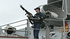 FILE: A sailor stands watch onboard the USS LaBoon as the ship sits docked in Philadelphia, Sunday, March, 16, 2003.